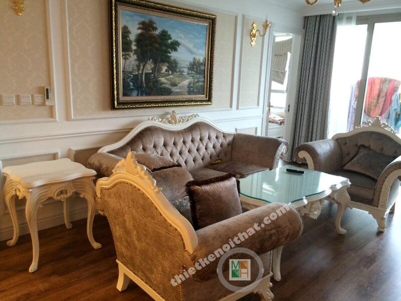 Bộ sofa gồm: một sofa bành và hai sofa đơn đi kèm với bàn trà thiết kế riêng